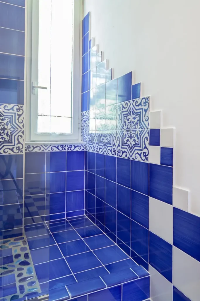 Use White Marble Tiles with Blue Accents